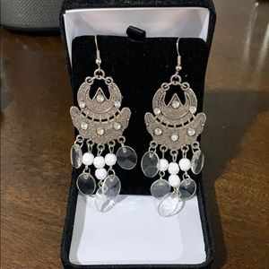 White and silver fashion earrings.